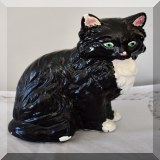 D103. Porcelain kitty with black glitter paint. Some flaking to paint. - $12 